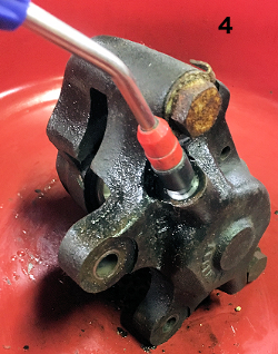 Using an Air Nozzle to Remove the Stuck Piston