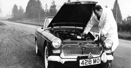 Running adjustments being made to a Midget on road test