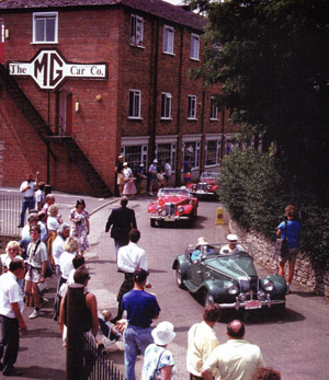 New England T Register parade past the administration building