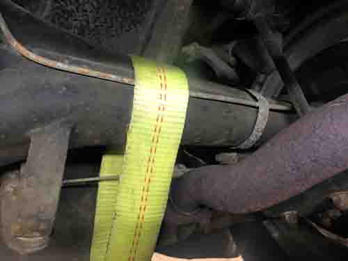 Improper rear axle strap mounting