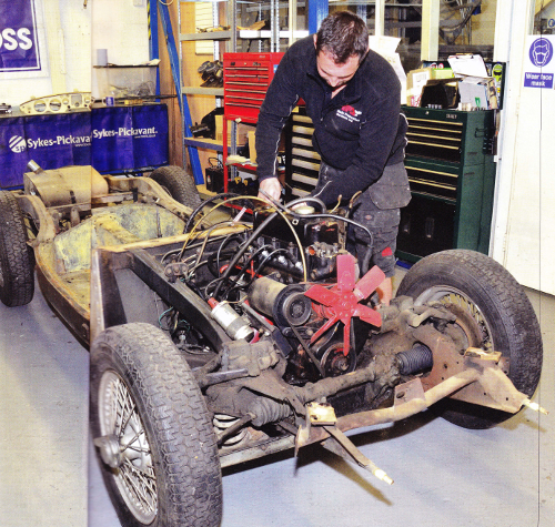 Ben Harris working on Mike Brewer's MGA